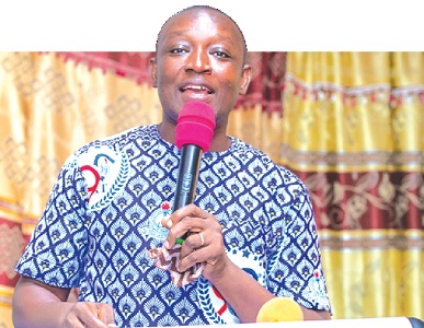  Emmanuel Akwo, headteacher of the school, addressing the pupils of the school during the launch